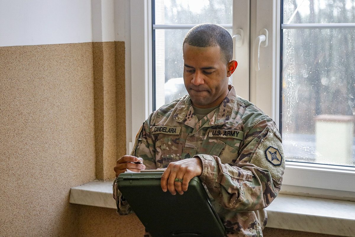 A clipboard holding a written checklist